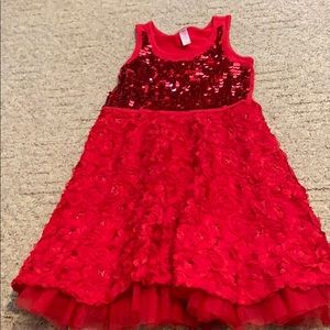 A red justice dress with sequins and flowers